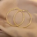 Orecchini a cerchio grandi in oro lucido su seta con design elegante e moderno - 6cm Diametro/Oro