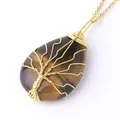 Golden wire-wrapped Tiger's Eye teardrop necklace with Tree of Life design on white background - Tiger's Eye Gold Necklace