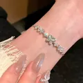 Elegant silver pearl bracelet with zircon flowers and a shimmering butterfly charm - Cat's Eye Butterfly Flower Bracelet Silver
