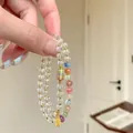 Double-layer beaded bracelet set with crystal stones and golden charms on wrist - Summer Rainbow Dopamine Color Crystal Bracelet