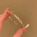 Elegant gold plated open cuff bracelet with rectangular cubic zirconia accents for women - Luxury Irregular Crystal Bangle