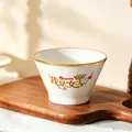 White ceramic bowl with golden Queen text and crown motif on a wooden tray - I am the Queen 5-Inch Conical Bowl