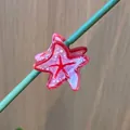 Pink resin starfish hair claw clip with glossy finish and red starfish pattern detail - Pink Small Starfish
