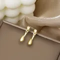 Elegant gold drop earrings with minimalist waterdrop design on a luxury jewelry box - Minimalist Double Waterdrop Drop Earrings (E3499-1) / Gold