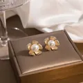 Elegant flower stud earrings with champagne petals and pearls on leather display - Artificial Pearl Flower Zirconia Studs (E3987-2) / Champagne