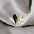 Elegant asymmetrical heart earrings featuring black enamel and white micro-bead details - Asymmetric Black and White Heart Studs (E4713-2) / Black