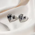 Elegant silver heart earrings with geometric faceted cut on white silk fabric - Multi-faceted Geometric Heart Studs (E4765-1) / Silver