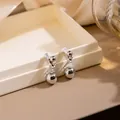 Silver geometric ball stud earrings in minimalist polished finish on a white jewelry box - Ball Linking Bar Geometric Studs (E3807) / Silver