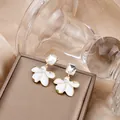 Elegant gold pearl earrings with starburst crystal and white enamel flower detail - Gold Gem White Enamel Flower Artificial Pearl Drop Earrings (E4926-1) / White