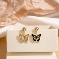 Elegant asymmetric butterfly earrings in black and beige enamel with golden metal edges - Black & Brown Patchwork Butterfly Enamel Style Drop Earrings (E2409-2) / Black Brown