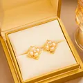 Golden flower stud earrings featuring white pearls and a sparkling center zircon - Gold Four-Petal Flower Artificial Pearl Rhinestone Stud Earrings (E4179-2) / Gold