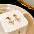 Elegant gold heart earrings with double layer white resin and sparkling crystal detail - Heart-shaped Double Layer Artificial Cat Eye Stone Earrings (E2405-4) / Gold
