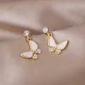 Elegant gold butterfly pendant earrings with white inlay and sparkling crystals - Butterfly Shell Inlaid Diamond Pendant Earrings (E2575) / Gold