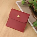 Red jewelry pouch in faux leather with gold snap button on a natural wood surface - PU Leather Snap Bag / 8*8cm / Burgundy