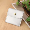 Silver PU leather jewelry pouch with gold snap button on a wooden background - PU Leather Snap Bag / 8*8cm / Silver