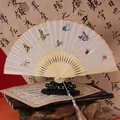 Classic Chinese folding fan featuring beige silk with colorful butterfly embroidery - 2026 Hot Selling Item - Suzhou Embroidery Fan - Butterfly Transformation