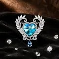 Prachtige zilveren hartbroche met groot blauw kristal en druppelvormige hanger op fluweel - Meerblauw