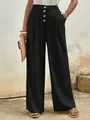 Detalle de pantalones de talle alto y pernera ancha con cuatro grandes botones frontales - S / Negro