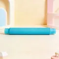Single blue telescopic pop tube toy for sensory play on a macaron geometric background - 19mmx140mm / Rainbow Sky Blue
