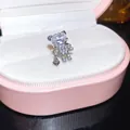 Detailed macro shot of a sparkling cubic zirconia teddy bear ear cuff in a pink jewelry box - Bear Style-Heart Pendant (3#) / Single Piece / Silver