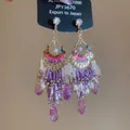 Detailed close-up of bohemian style tassel earrings with purple crystals and gold accents. - Streaming Flower Tassel (43# 925 Sterling Silver Earring Post) / Purple