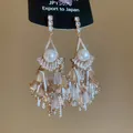 Elegant crystal tassel drop earrings featuring a pearl center and sparkling rhinestones - Streaming Flower Tassel (41# 925 Sterling Silver Earring Post) / Gold