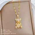 Dettagli del ciondolo a orsetto dorato con cristalli e opale a forma di cuore - Orso Dorato (F107)