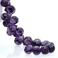 Macro shot of faceted dark purple K9 crystal teardrop beads with high clarity and sparkle - Violet / 8mm (Approx 87 beads/strand)