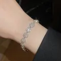Elegant silver flower bracelet with sparkling crystals for a luxury refined look - Hollow Flower / Silver