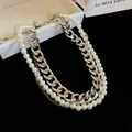 Macro view of detailed layered silver-tone curb chain and elegant white pearl necklace - European Multi-layer Necklace-Silver White / Silver