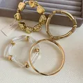 Ensemble de bracelets joncs dorés et bracelets en acrylique transparent pour femmes - Style 52 / Set de 4 pièces / Or