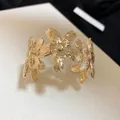 Elegant 18K gold-plated open cuff bracelet featuring a detailed cherry blossom floral design - Cherry Blossom Shape Style (61#) / Gold