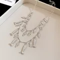 Vintage silver double-layered necklace featuring intricate small fish charms. - Double Layer Design / Silver