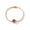 Close-up detail of a gold-plated tennis bracelet with a purple clover pendant and zircons - Gold Purple