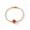 Detailed view of a gold-plated tennis bracelet with a red four-leaf clover motif - Gold Red Zirconia