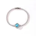 Elegant silver-plated tennis bracelet featuring a blue four-leaf clover charm with crystals - Platinum Blue Zirconia