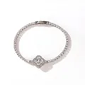 Sparkling silver-finish tennis bracelet featuring a central clover flower design - Platinum White Zirconia