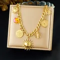 Bracelet doré à breloques multiples avec pendentifs soleil et lune sur chaîne - N3763