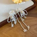 Handmade white bead tassel drop earrings with delicate yellow shell flower accents - Silver Post Shell Flower Tassel Style / White