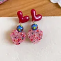 Close-up of sweet resin heart drop earrings with colorful polka dot beads and glitter - Contrast Polka Dot Crushed Stone Heart Style / Red-Multicolor