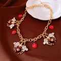 Detailed view of vintage gold chain necklace with enamel insect and crystal charms - Single Necklace / Gold-Red
