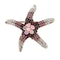 Starfish brooch with gold plating and colorful pavé rhinestones in a vibrant gradient - Purple