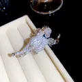 Macro detail of a sparkling silver horse brooch fully inlaid with shimmering zircon stones - Silver