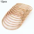 12-teiliges Set minimalistischer Stapelarmreifen aus roségold vergoldetem Edelstahl - 12er Set / Roségold / Innendurchmesser 55mm