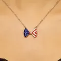 Bow necklace featuring American flag stars and stripes pattern with silver cross chain - Silver Bow American Flag Necklace