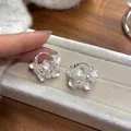 Close-up of elegant flower basket earrings featuring pearls and sparkling crystals - Flower Basket Ear Buckle / Silver