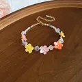 Close-up detail of a colorful resin flower bracelet with iridescent crystal beads - 59# Bracelet / Colorful