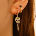Gold evil eye huggie hoop earrings with blue stones and spiked charms for women - KC Gold