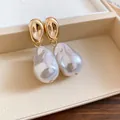 Elegant close-up view of French retro baroque pearl earrings in a beige gift box - Large Style (HE33517) / Gold with White
