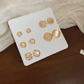 Detailed close-up of cat's eye stone stud earring set in various geometric shapes - Amber/Opal-look (33# Silver Earring Post)